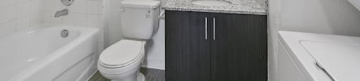 Bathroom with in unit laundry at Brenton at Abbey Park Apartments in West Palm Beach FL
