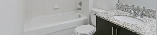 Bathroom with shower tub at Brenton at Abbey Park Apartments in West Palm Beach FL