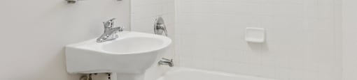 White bathroom with sink at The Barrington in Silver Spring MD