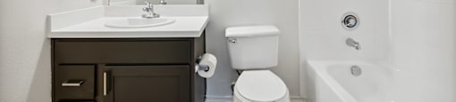 Bathroom with kitchen and toilet at Bonito Parque Apartments in San Antonio TX