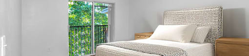 Bedroom with furniture at Cedar Grove Apartments in Miami FL
