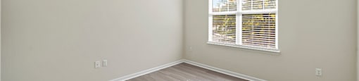 Bedroom with window at Grand Oaks Apartments in Chester VA