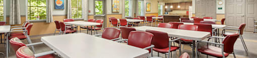 Community lounge and kitchen at Fairbrooke Senior Apartments in Aberdeen MD