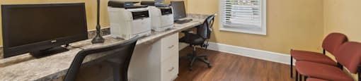 Computer and printer room at Falls Pointe at the Park Apartments in Durham NC