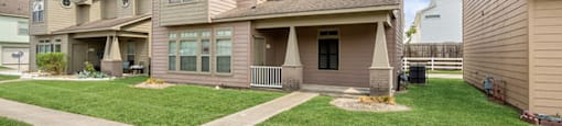 Apartments with lush landscaping at Fountains at Tidwell and The Enclave in Houston TX