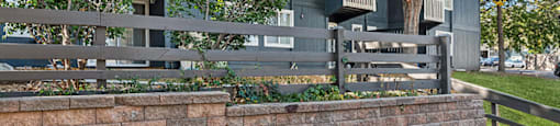 Exterior Buildings with Fence at The Pines in Lakewood CO