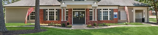 Exterior leasing office at Park Village Apartments in Conroe TX