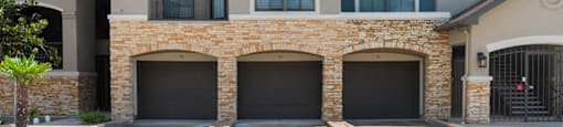 Exterior parking and patio spaces at Parkway Senior at Parkway Senior Apartments in Pasadena TX
