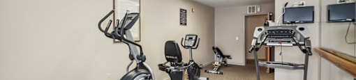 Fitness center treadmill at The Woods at Victoria Park Apartments in Woodbridge VA