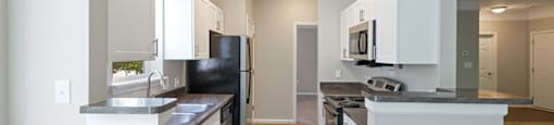 Kitchen at Falls Pointe at the Park Apartments in Durham NC