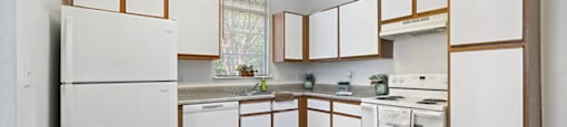 Kitchen with appliances at Fountains at Tidwell and The Enclave in Houston TX
