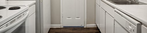 Kitchen cabinets at Park Village Apartments in Conroe TX