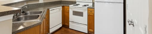 Kitchen with wood cabinets at Longwood Vista Apartment Homes in Atlanta GA