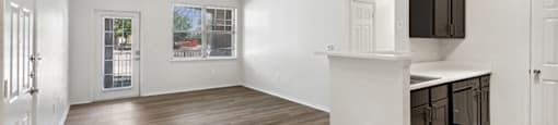 View of living room from kitchen at Bonito Parque Apartments in San Antonio TX