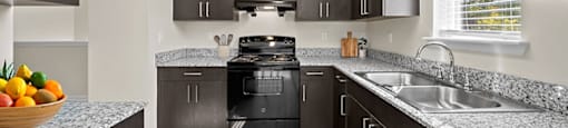 Kitchen with plenty of cabinets at Grand Oaks Apartments in Chester VA