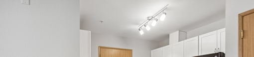Pet-Friendly Senior Apartments In Federal Way -Renovated Kitchen with New Countertops With Breakfast Bar, New Energy-Efficient Appliances, Microwave, Oven, And Fridge