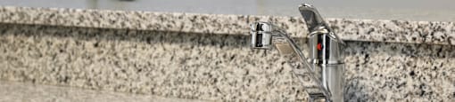 Granite kitchen counter top at Brenton at Abbey Park Apartments in West Palm Beach FL