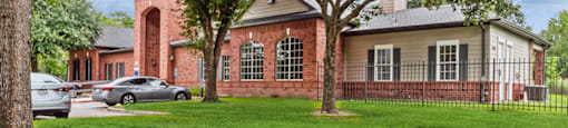 Exterior of leasing center at Hollow Creek Apartments in Conroe TX