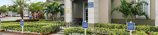 Exterior of leasing office at Brenton at Abbey Park Apartments in West Palm Beach FL