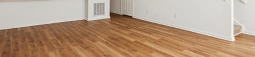 Living room with hardwood floor at Broadwater Townhomes in Chester VA