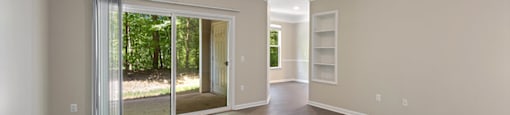 Living Room with window at Falls Pointe at the Park Apartments in Durham NC