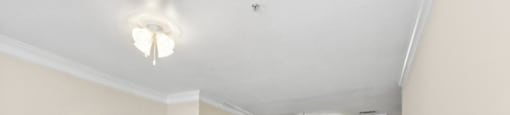 Living room with carpet and lighting at Longwood Vista Apartment Homes in Atlanta GA