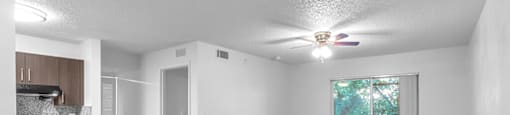 View of living room and kitchen at Cedar Grove Apartments in Miami Gardens FL