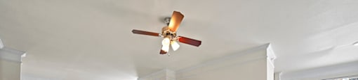 Living room with ceiling fan at Grand Oaks Apartments in Chester VA