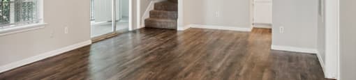 Living room with overhead lighting at Park Village Apartments in Conroe TX