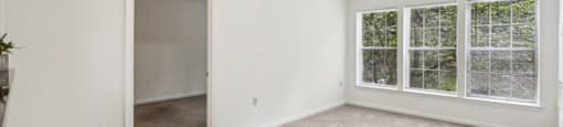 Living room at The Woods at Victoria Park Apartments in Woodbridge VA