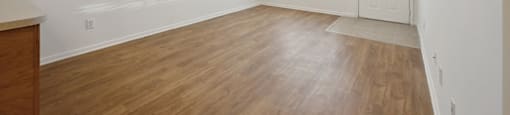 Living room with wood style flooring at Fallbrook Ranch in Houston TX