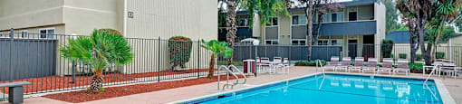 Trestles Apartments pool with chairs in San Jose, CA