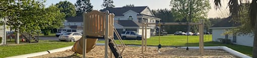 Playground outside at Dayton Park Apartments in Dayton TX