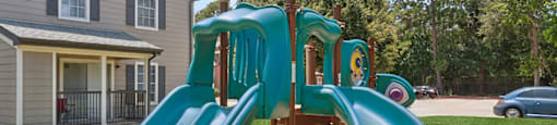 Playround slide at Park Village Apartments in Conroe TX