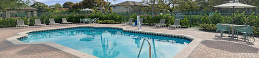 Pool with landscaping at Running Brook Apartments in Miami FL