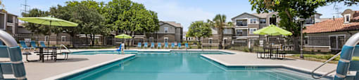Outdoor swimming pool at Bonito Parque Apartments in San Antonio TX