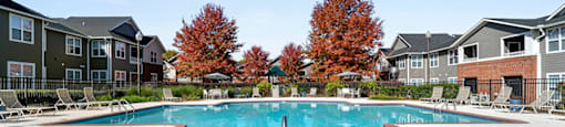Pool surrounded by deck at Grand Oaks Apartments in Chester VA