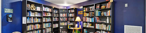 Social lounge reading area at Woodlands at Forbes Lake Apartments in Kirkland WA