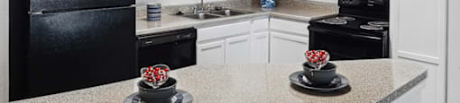 Kitchen with appliances at Tidwell Estates in Houston TX