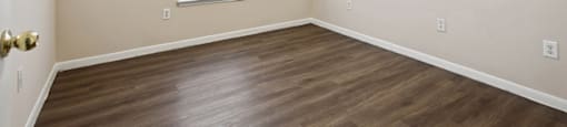 Bedroom with wood flooring at Fountains at Tidwell and The Enclave in Houston TX