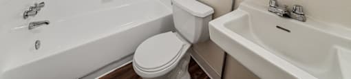 Bathroom with sink and tub at Ridgemoor Apartment Homes in Lakewood CO
