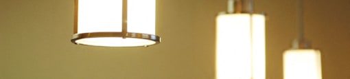 Two hanging lights with a warm glow at Centre Place Apartments, Denton, 76205