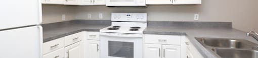 Spacious kitchen with white cabinetry