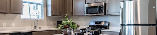 Kitchen with island at ARISTA APARTMENT HOMES, Las Vegas, NV, 89183