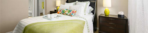 Spacious bedroom with walk-in closet and ceiling fan at The Lanesborough Apartments in Houston.