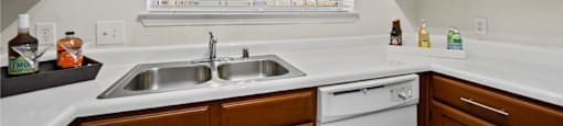 Luxury apartments with spacious kitchens, custom home cabinets, and side-by-side refrigerators at The Lanesborough Apartments in Houston.