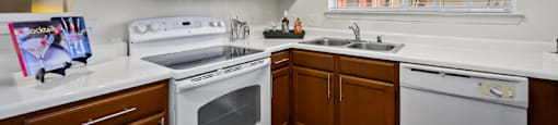 Luxury apartments with spacious kitchens, custom home cabinets, and side-by-side refrigerators at The Lanesborough Apartments in Houston.