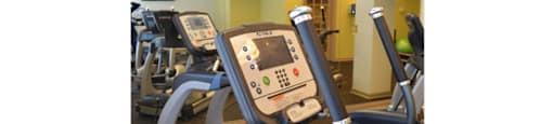 Fitness center with cardio equipment; flat screen TV