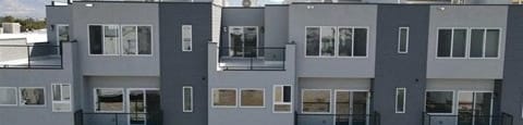 an exterior view of multiple townhomes