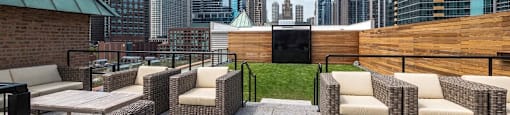 Chicago luxury apartment roof deck with seating and outdoor movie screen